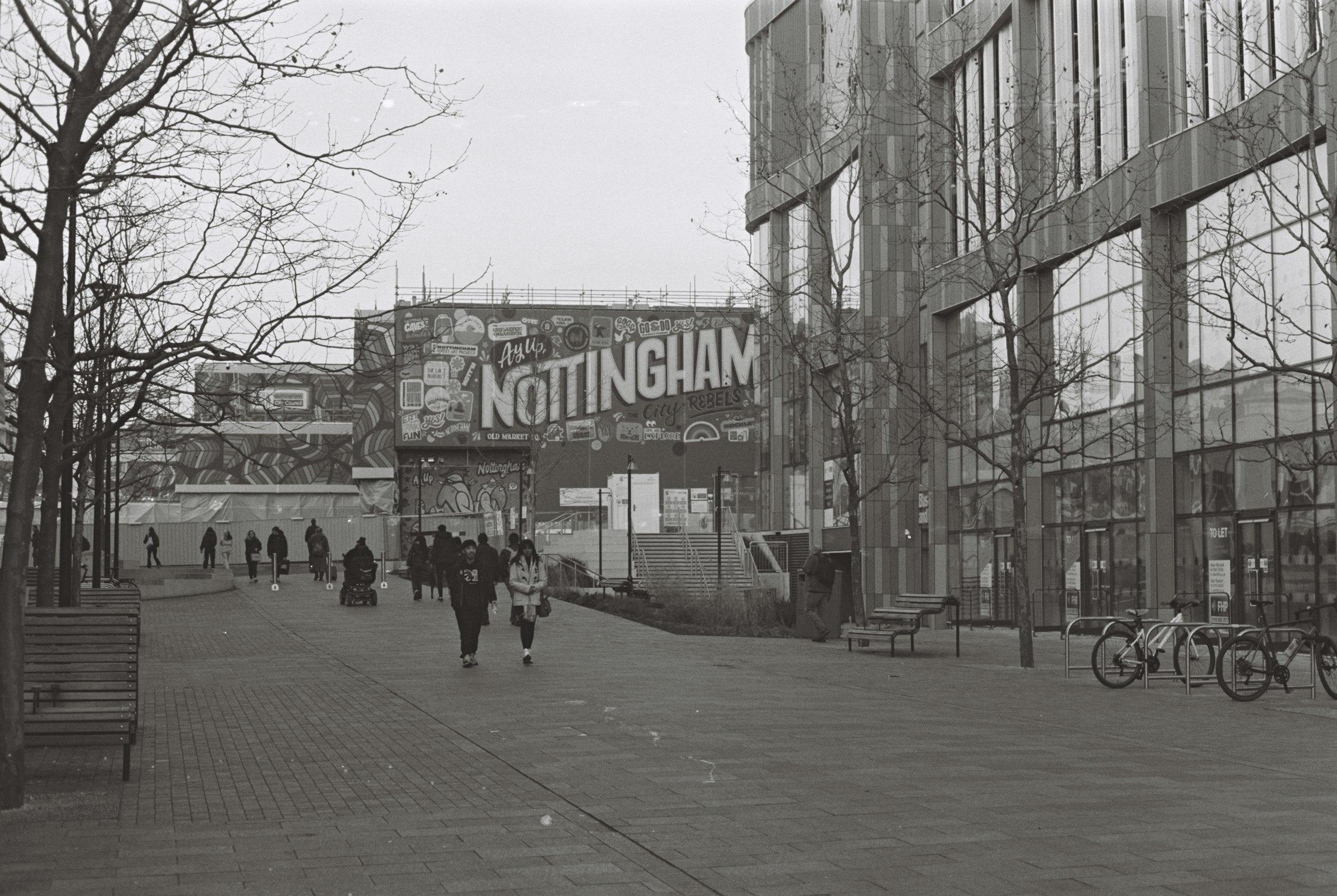 People walking on a city street, shot on 35mm film