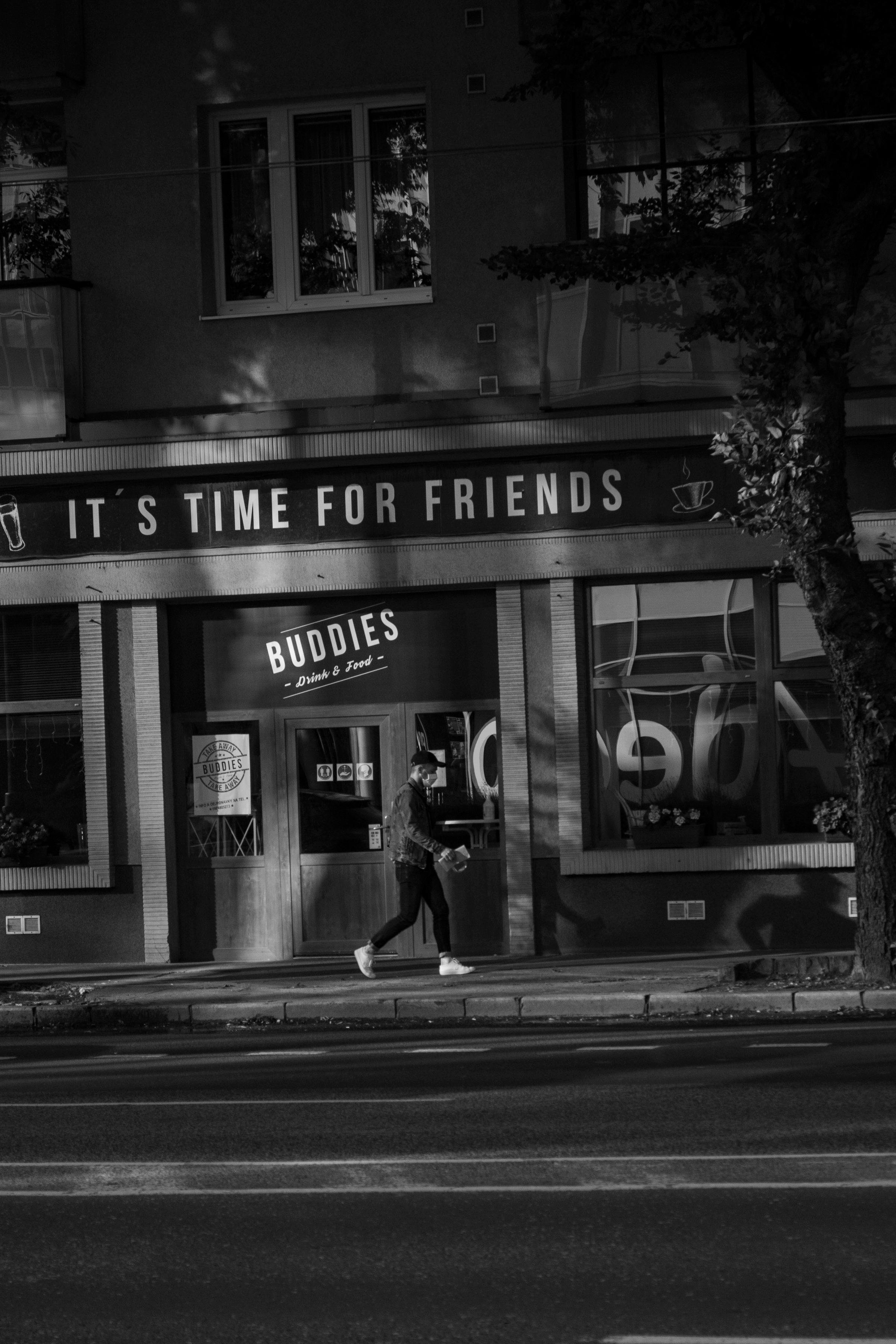 A person walking past a shopfront